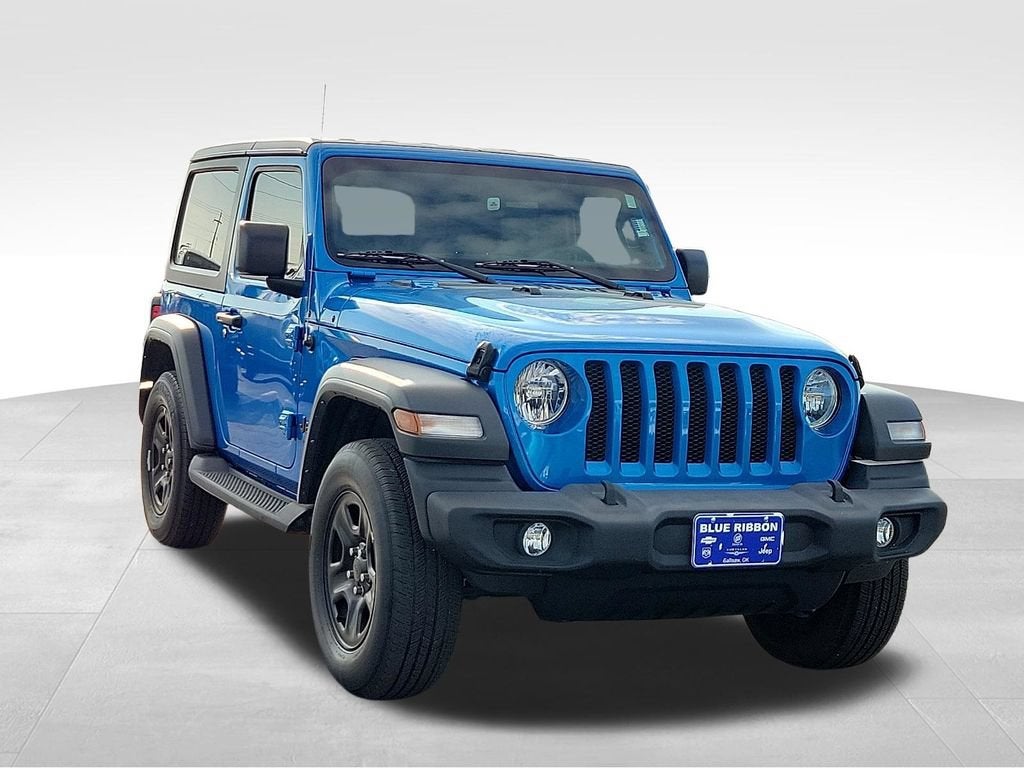 2023 Jeep Wrangler Sport in Blue — front three-quarter view