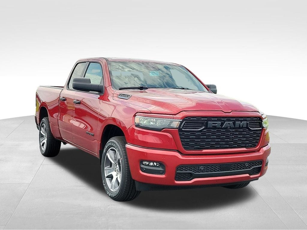 2026 RAM 1500 Express in Molten Red Pearlcoat — front three-quarter view