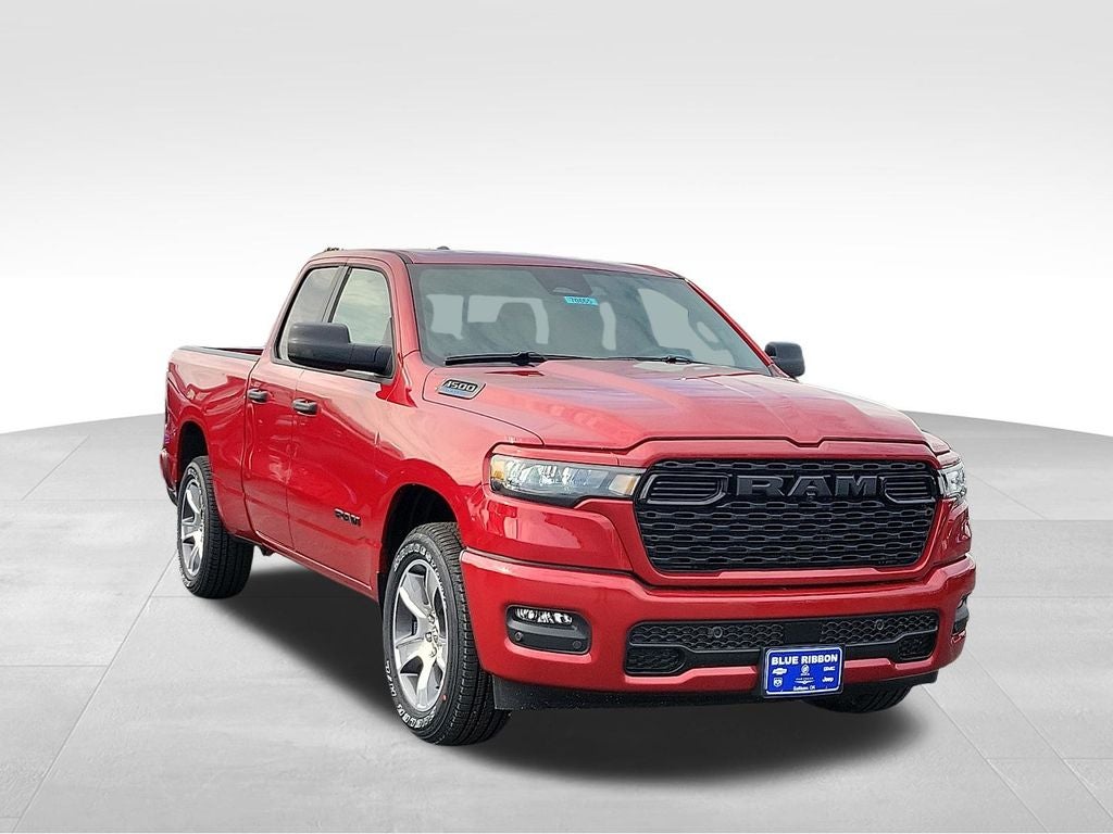 2026 RAM 1500 Express in Molten Red Pearlcoat — front three-quarter view