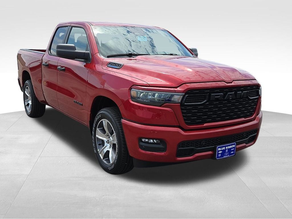 2026 RAM 1500 Express in Molten Red Pearlcoat — front three-quarter view