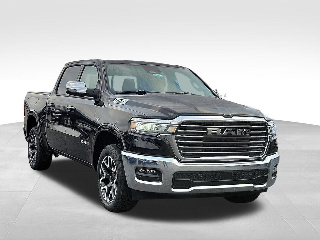 2026 RAM 1500 Laramie in Diamond Black Crystal Pearlcoat — front three-quarter view