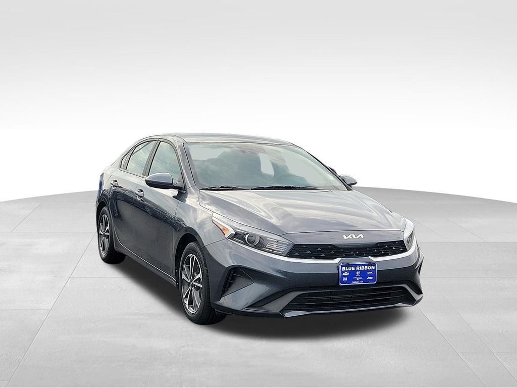 2024 Kia Forte LXS in Gravity Gray — front three-quarter view